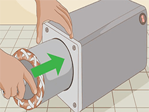 Illustration of a coil being fitted into a housing during a simple DIY build